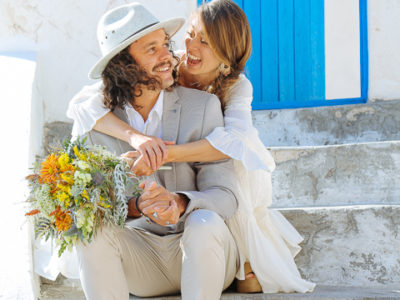 bride and groom having a good time in Santorini island