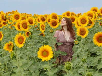 Portrait of a woman in a sunflowers field in Chalkidiki penninsula Greece