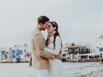 engagement photograph of a new engaged couple in front of Little Venice Mykonos