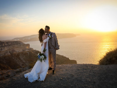 location portraiture of bride and groom kissing at sunset hour